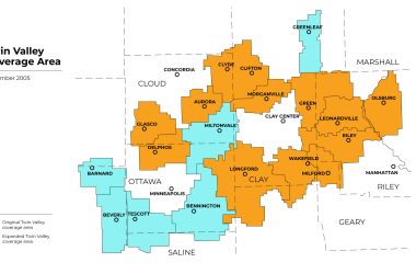 Map of Twin Valley’s coverage area in December 2005, celebrating a major milestone by showing original service territories in blue and newly expanded areas in orange, including added exchanges such as Aurora, Glasco, Delphos, Clyde, Leonardville, Riley, Wakefield, Milford, Olsburg, and surrounding communities.