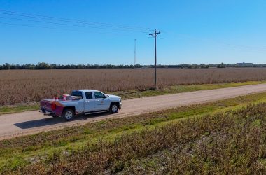 Twin Valley service truck driving along a rural Kansas road during broadband infrastructure expansion